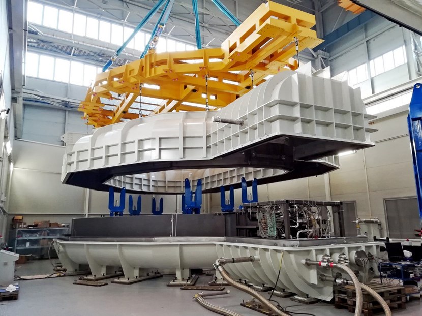 The first toroidal field winding pack (110 tonnes) fabricated in Europe is lowered into a specially designed cryostat for cold testing. © SIMIC (Click to view larger version...)