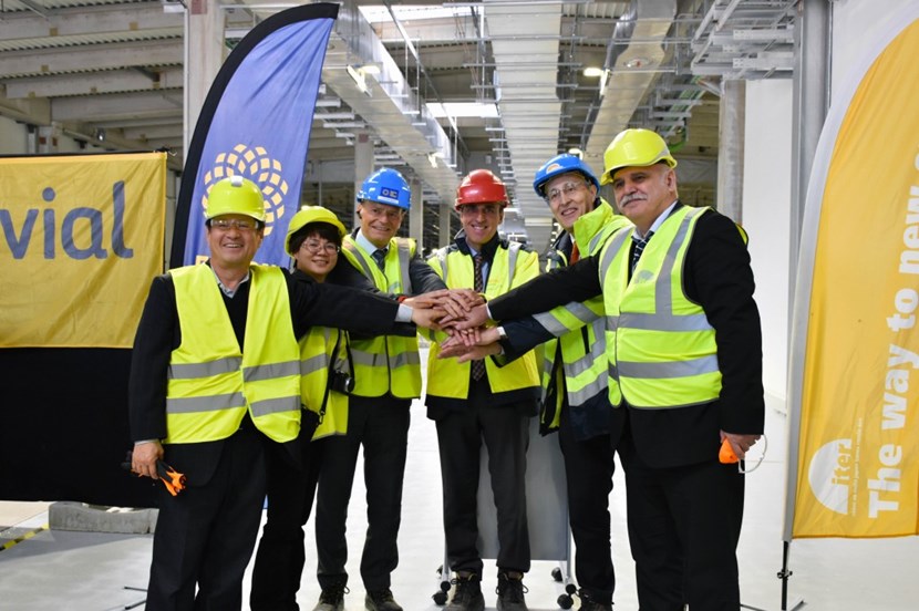 ITER's Bernard Bigot (second from right) takes ownership of three buildings from Fusion for Energy (represented here by Director Johannes Schwemmer, third from left). Also present were: ITER Korea head Kijung Jung; one of the deputy heads of ITER China, Min Wang; Joaquin Garcia of the European contractor Ferrovial; and the head of ITER Russia Anatoly Krasilnikov (from left to right). (Click to view larger version...)