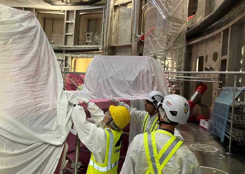 Members of the OHB/ITER team are installing protective textile coverings in the Tokamak pit as part of the CRIUS III phase of the cleanliness engineering project. (Click to view larger version...)